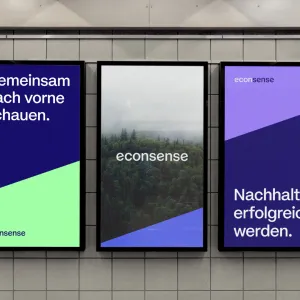 Three illuminated posters in blue and green tones featuring a nature motif and the messages “Looking ahead together.” and “Achieving sustainable success.”