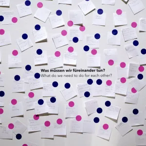 Wall full of sticky notes with visitors' answers to the question 