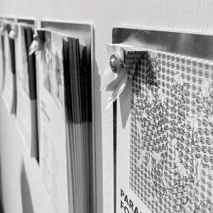 Tear-off catalog pages on wall holders