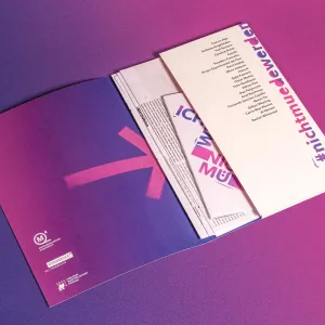 Folder and folder contents form the exhibition catalog, with pink and purple spray paint elements