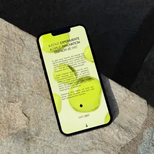 Smartphone screen with light green three-dimensional drops as a decorative element in the background of a text