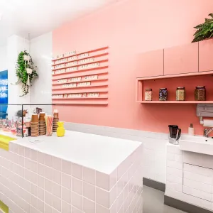 A look behind the counter with the various toppings in jars