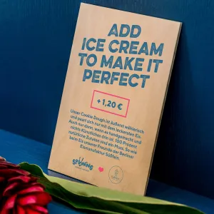 Price tags are printed in dark blue rustic lettering on small wooden panels