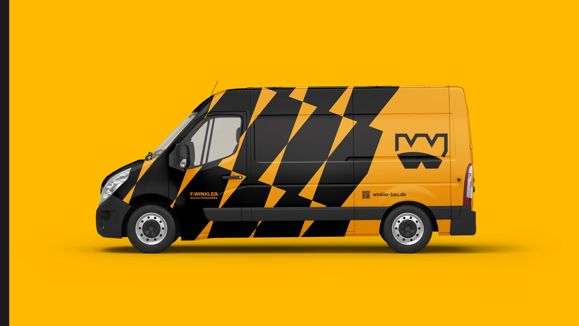 Transporter im markanten leuchtend-gelb und schwarzen Winkler-Design, zeigt großflächig das neue geometrische Muster und die Bildmarke